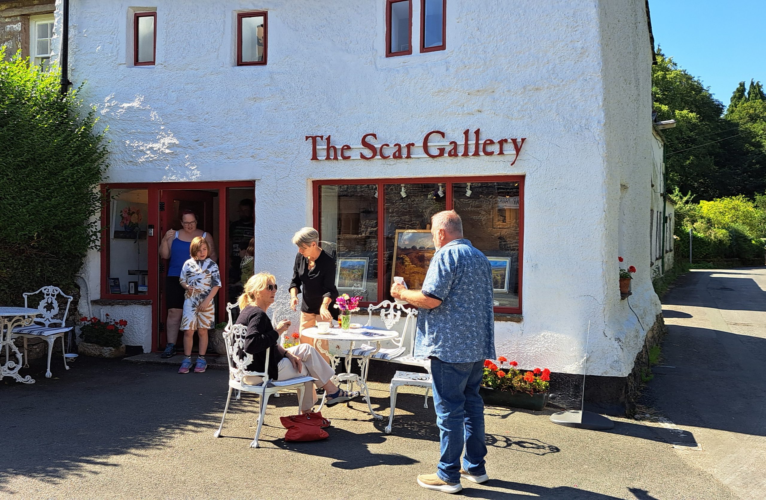 Exterior photgraph of whitewashed stone cottage, housing the Scar Gallery
